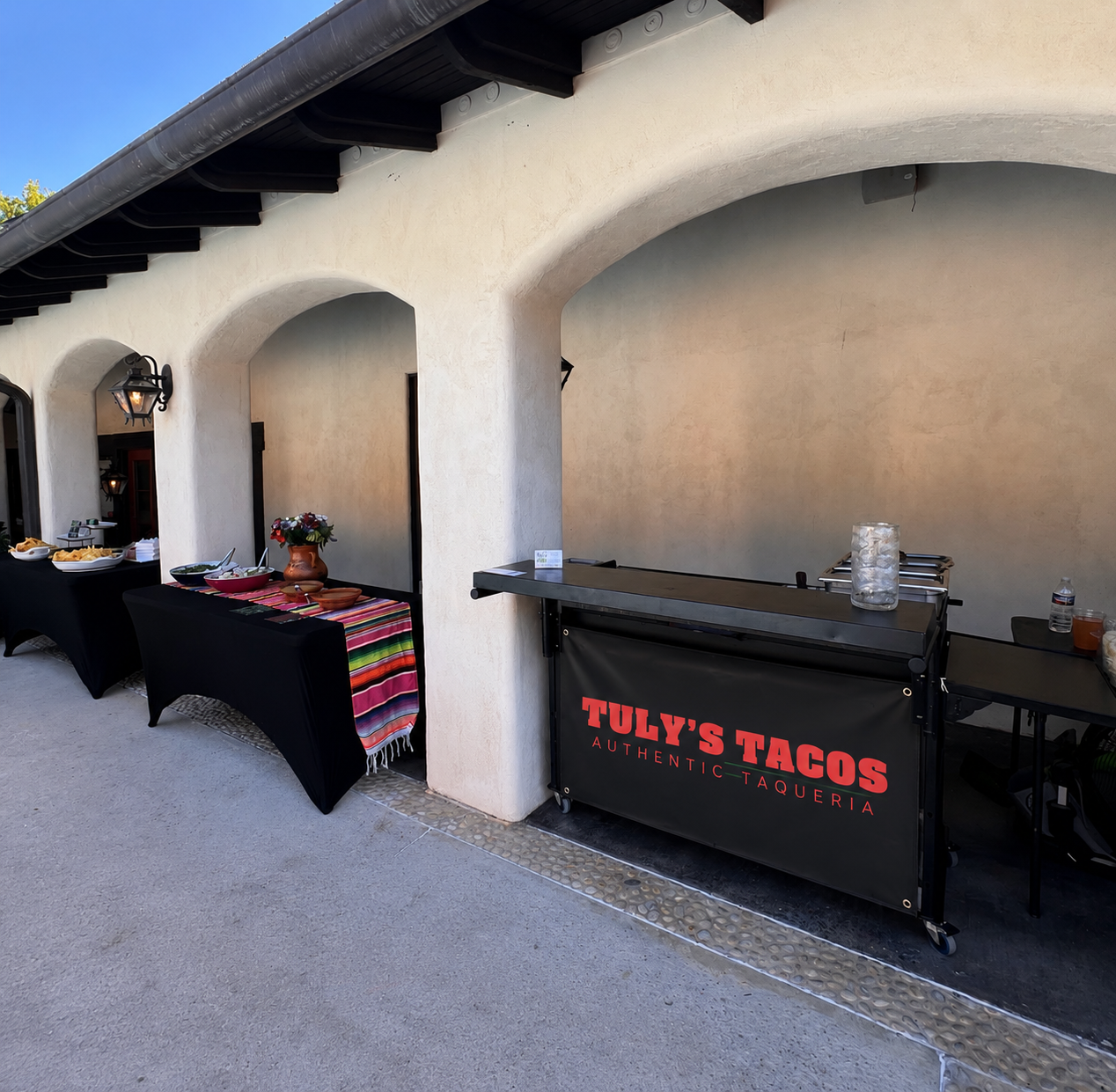 Tuly's catering grill under stucco arches