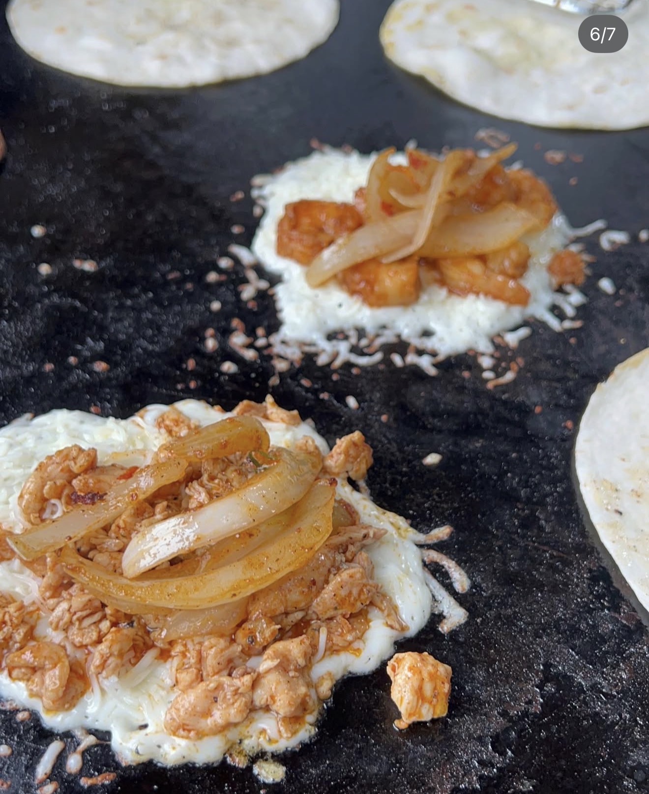 Quesadillas cooking on a flat top