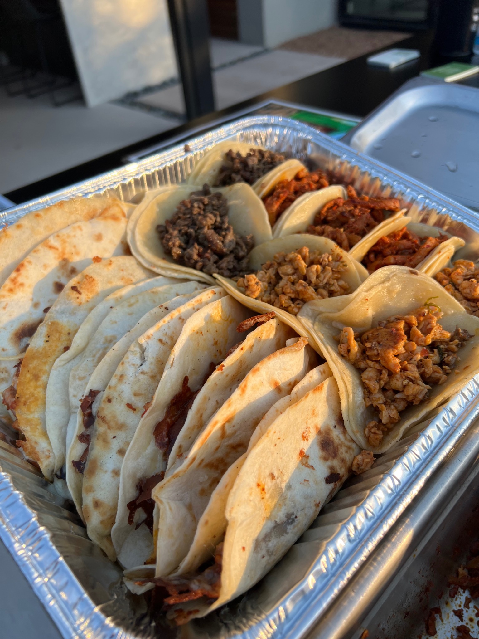 Large tray of tacos and quesadillas